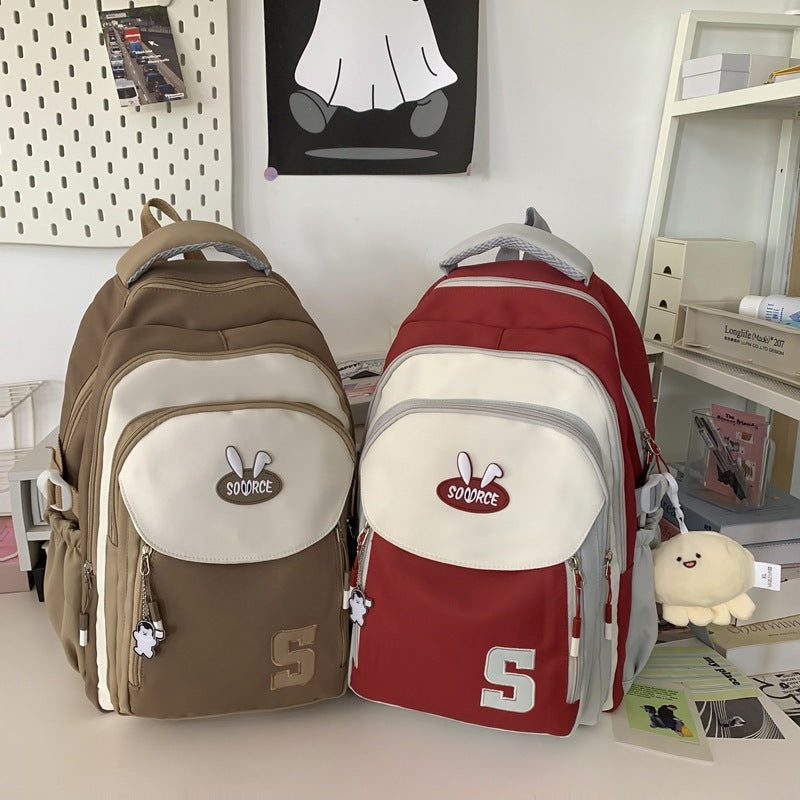 Harajuku large capacity schoolbag in red and khaki colors with front zipper pockets and letter pattern design.