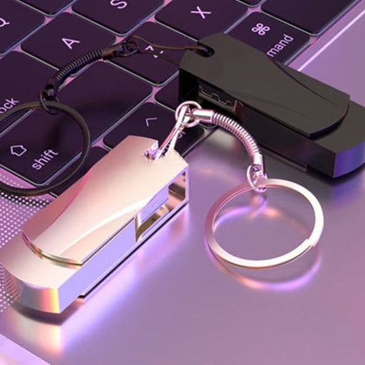 Metal USB drives with keychain on a laptop, available in black and silver.