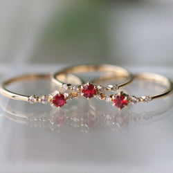 Fashionable 16k gold engagement ring with rubies and diamonds.