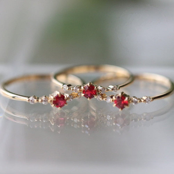 Fashionable 16k gold engagement ring with rubies and diamonds.