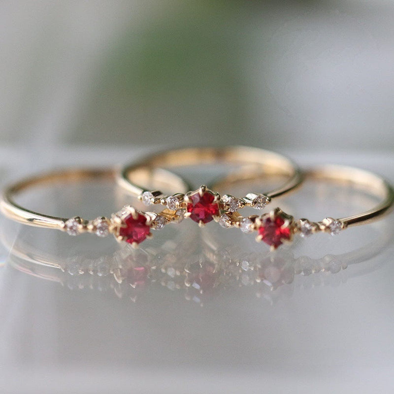 Fashionable 16k gold engagement ring with rubies and diamonds.