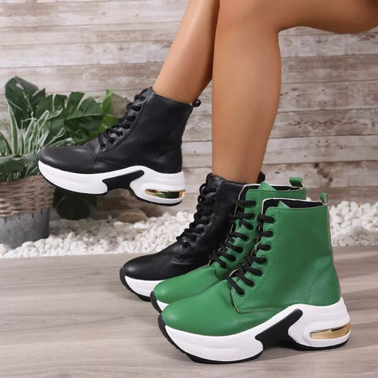 Lace up platform ankle boots in black and green PU leather with mid heels and rubber soles