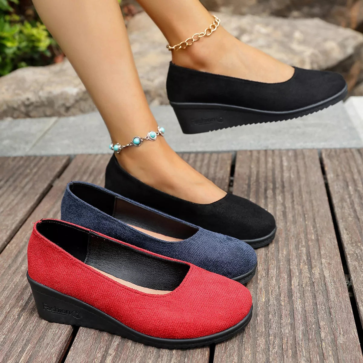Wedge heel slip-on loafers in black, navy, and red with mid heels and rubber soles