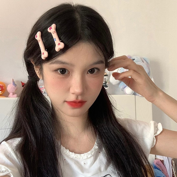 Bone Print XINGX duckbill hair clips for women.