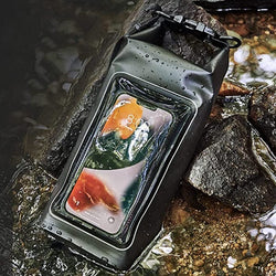 Water-proof outdoor crossbody mobile phone bag in black, surrounded by water and rocks.