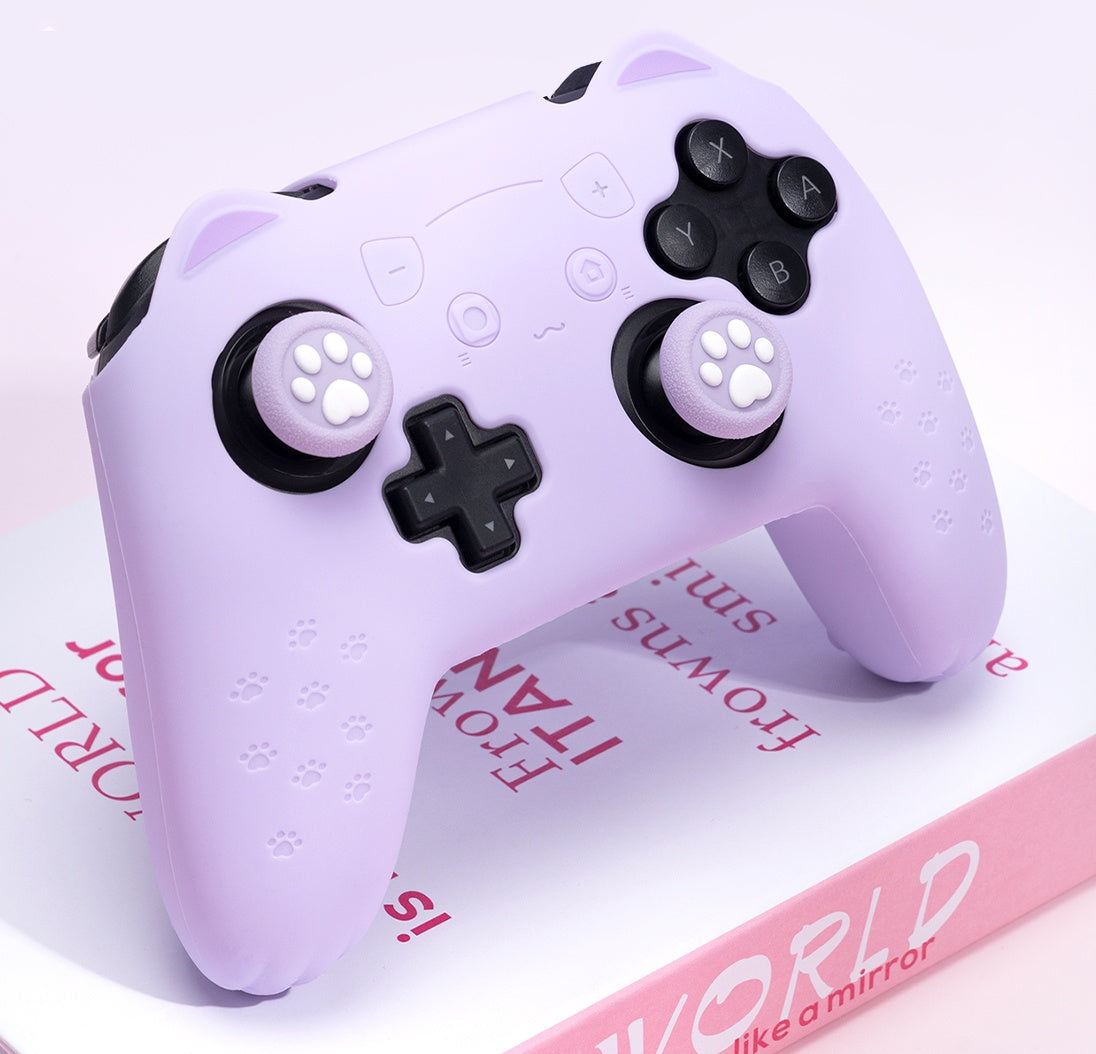 Silicone sleeve for gaming controller in pastel purple with paw-designed rocker caps.