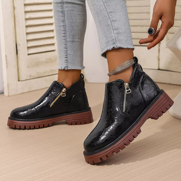 Black PU leather round toe boots with mid block heels and brown rubber soles