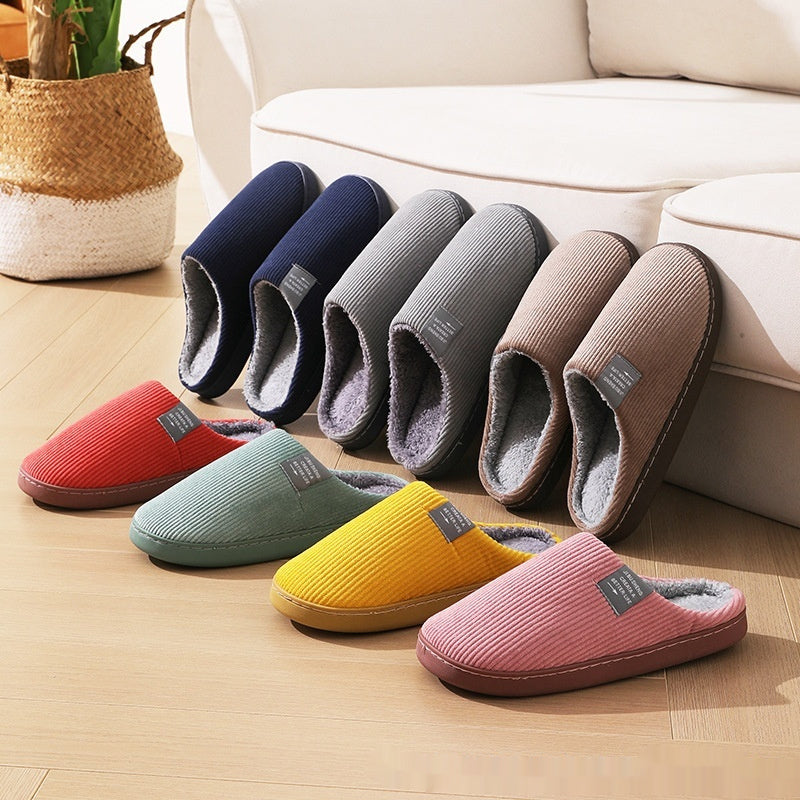 Home indoor wear-resistant non-slip cotton slippers in various colors displayed on wooden floor.