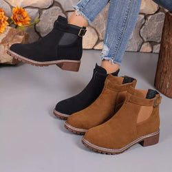 Round toe block heel boots in black and brown PU leather with mid-height heel and buckle detail