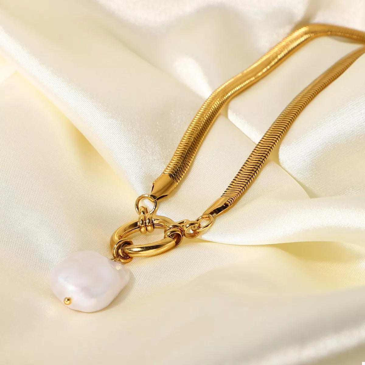 18K Gold-Plated freshwater pearl pendant necklace with stainless steel chain on satin fabric