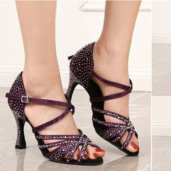 Women's purple silk Latin dance performance shoes with rhinestone embellishments and strappy design.