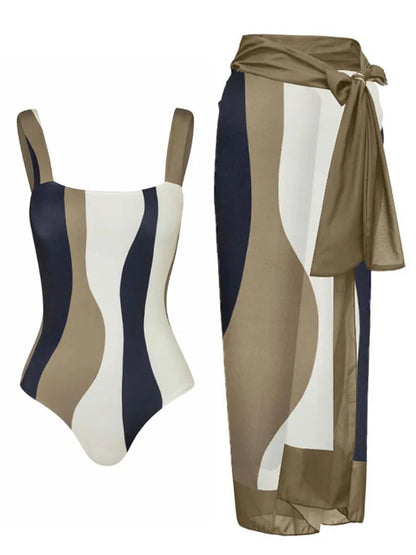 Siamese conservative belly covering striped one-piece swimsuit with matching gauze skirt.