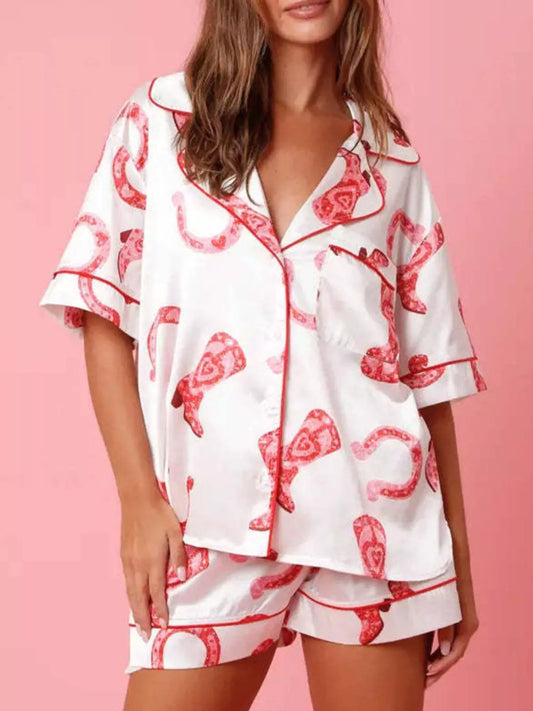 woman wearing button up half sleeve shirt and shorts lounge set with red print on white