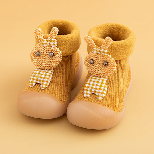 Cartoon rabbit-themed yellow baby toddler shoes with thick warm polyester upper.
