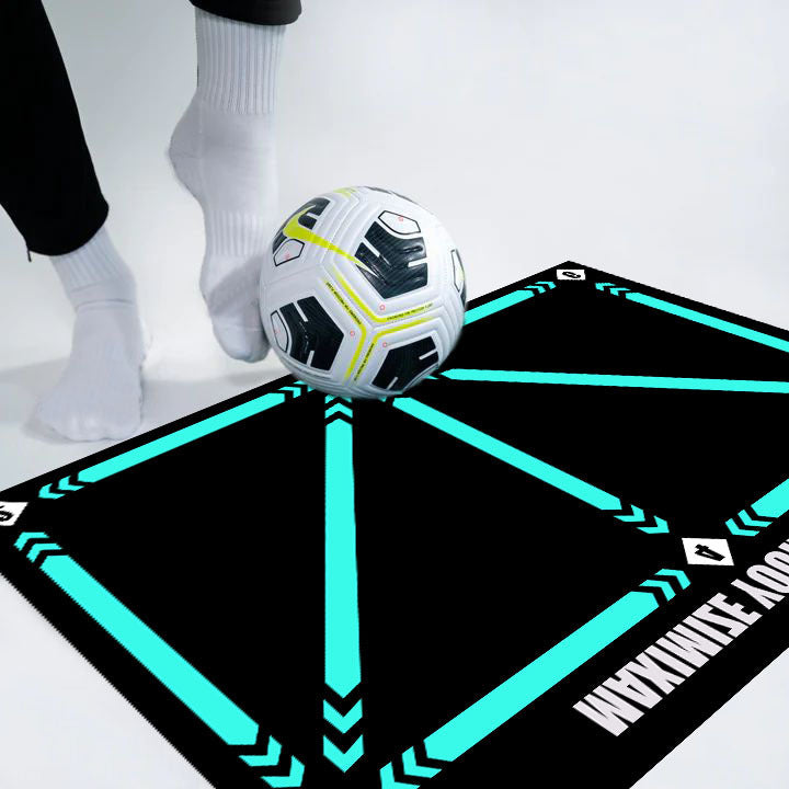 Indoor football training mat with football and person practicing skills.