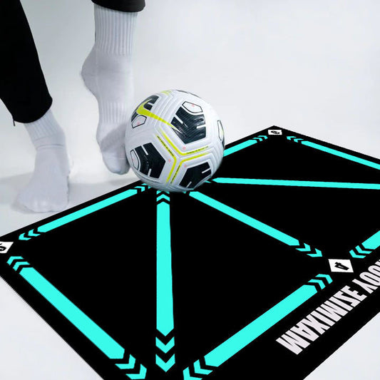 Indoor football training mat with football and person practicing skills.