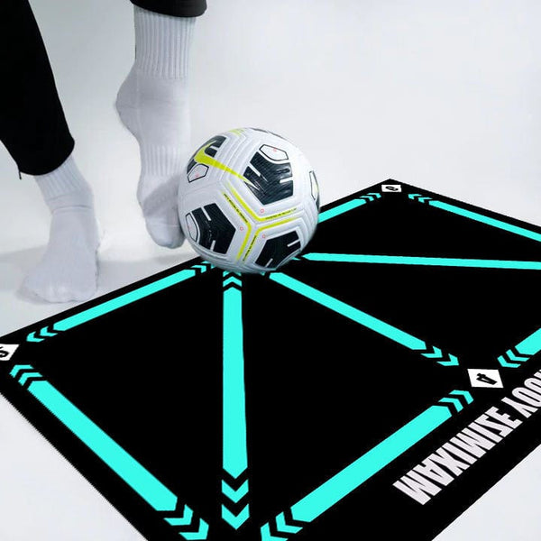 Indoor football training mat with football and person practicing skills.