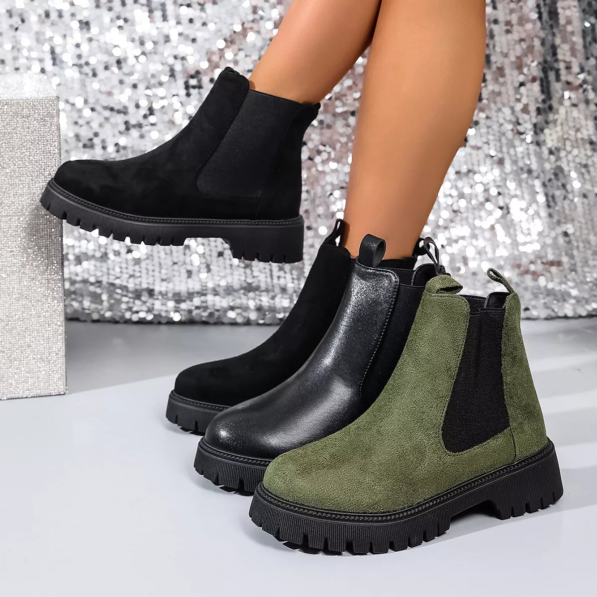 Elastic side panels ankle boots in black, olive green, and black leather with mid heels and rugged soles