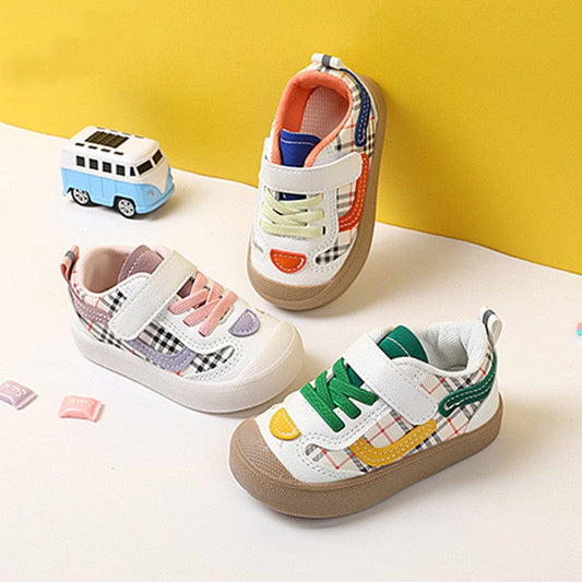Baby boy and infant toddler casual shoes with striped pattern in green, blue, and pink, featuring low top design and Velcro fastening.
