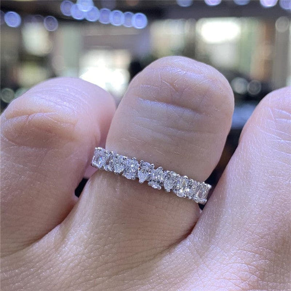 Unisex silver ring with inlaid waterdrop rhinestones, showcasing simple luxury style.