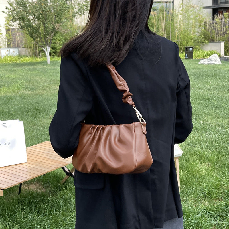 Pleated cloud casual shoulder bag in brown PU leather.