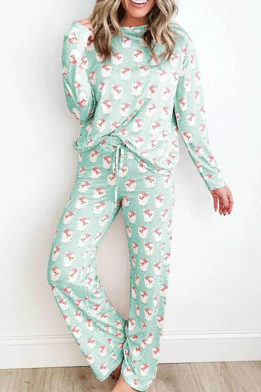 Woman wearing mint green Santa print long sleeve top and pants lounge set