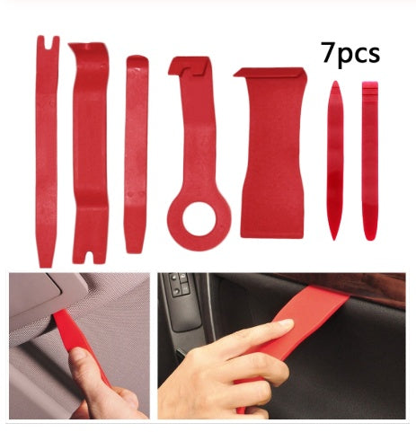 7-piece red automotive trim removal tool set for surface treatment.