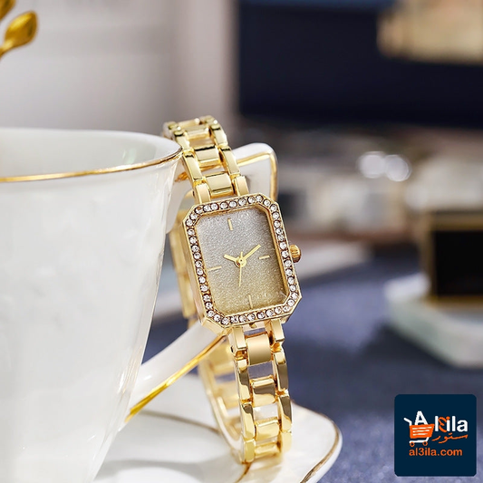 Elegant women's watch in gold with rhinestone accents and a casual, compact design.