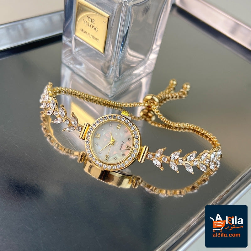 Diamond-embedded adjustable bracelet quartz watch in gold.