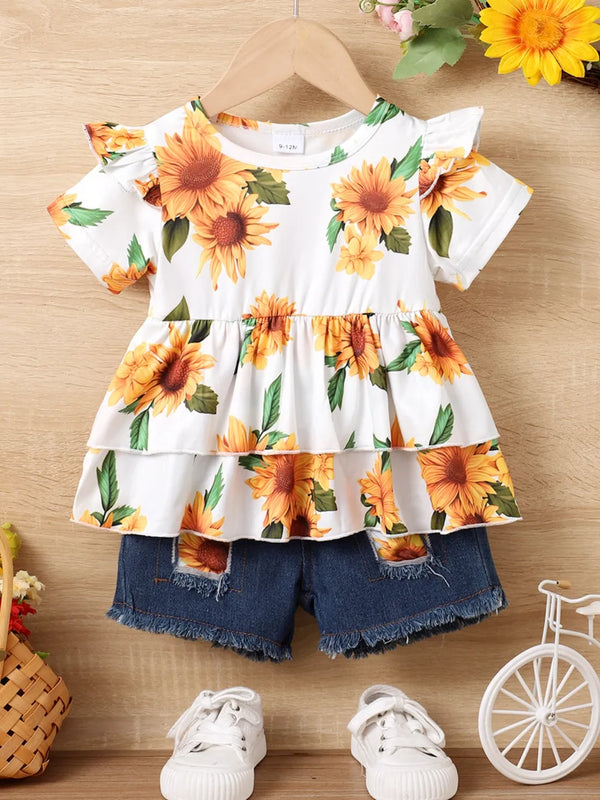 Children's sunflower ruffled short sleeve top with layered design and denim shorts set on hanger