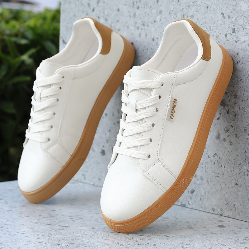 Men's Korean-style fashionable sports shoes with white upper and brown sole, featuring front lace-up design and breathable mesh lining.