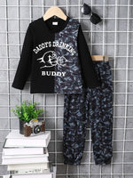 Children's camouflage color block top and pants set with black and camo design, long sleeves, and printed text "Daddy's Drinking Buddy"