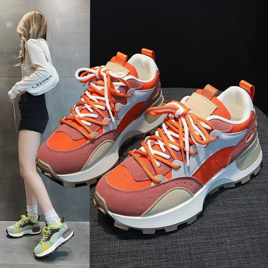 Lightweight Cortez women's retro platform sneakers in orange and green with low flat heel.