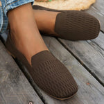 Brown mesh square toe slip-ons flats worn on wooden floor