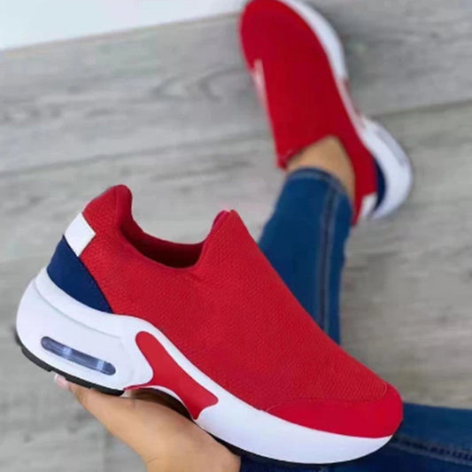 Women's fashion stretch round toe knit sneakers in vibrant red with white and navy accents.