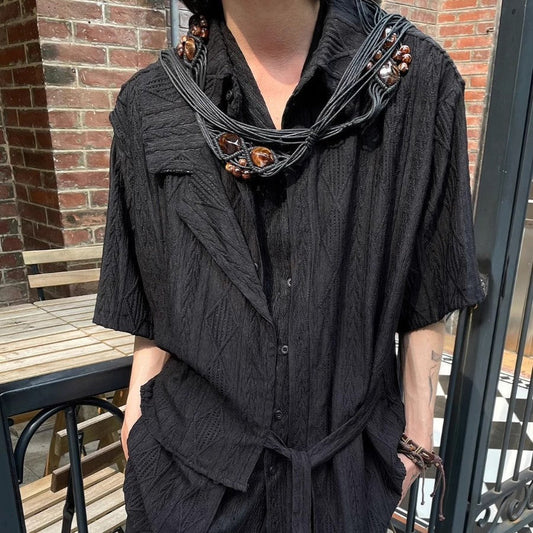 Retro jacquard texture hollow short sleeve top in black, loose fit, polyester fabric.