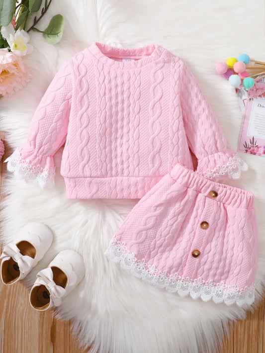 Pink children's lace detail top and skirt set with cable knit pattern and white lace trim