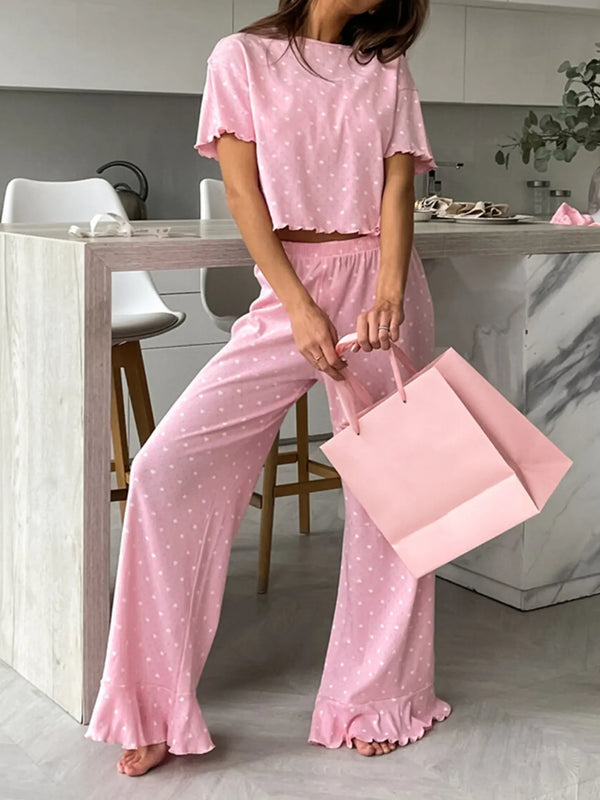 Pink polka dot round neck top and pants lounge set with ruffled edges and slightly stretchy fabric