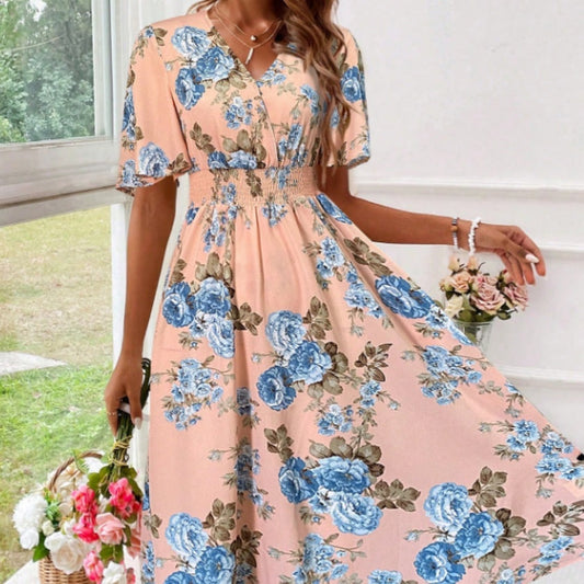 Women's floral print cinching waist dress with blue flowers, V-neck, and flanged short sleeves.