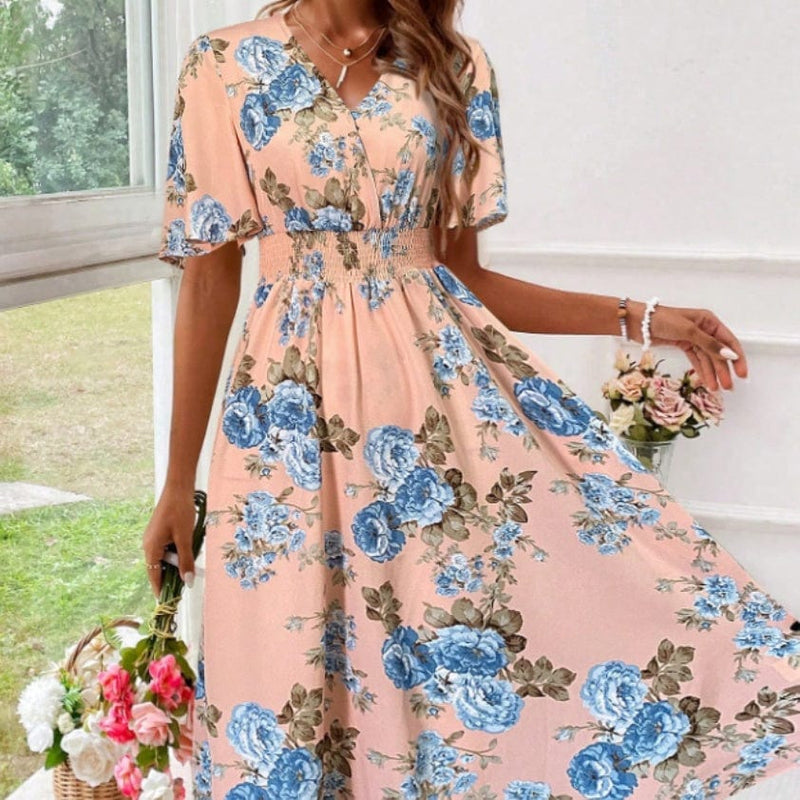 Women's floral print cinching waist dress with blue flowers, V-neck, and flanged short sleeves.