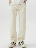 Men's wide leg jeans in light beige with pockets and slight stretch, made from cotton and polyester blend