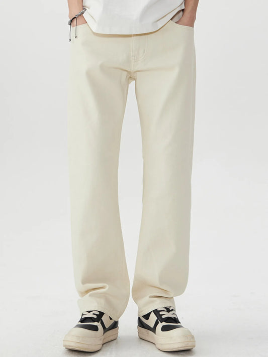 Men's wide leg jeans in light beige with pockets and slight stretch, made from cotton and polyester blend