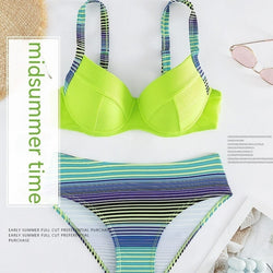 Green printed sexy halter bikini set for women with split style and sleeveless design.