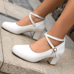 White chunky heel Mary Jane shoes with buckle strap, featuring a high heel design.