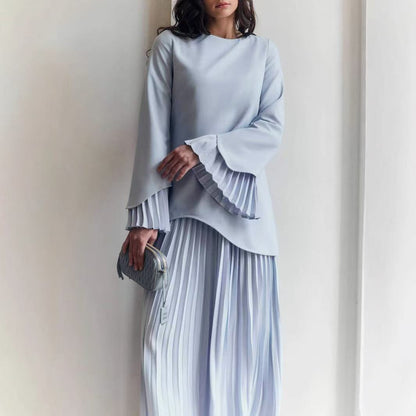 Round neck loose casual top and pleated mid-length skirt in light blue, polyester fabric, long sleeves.