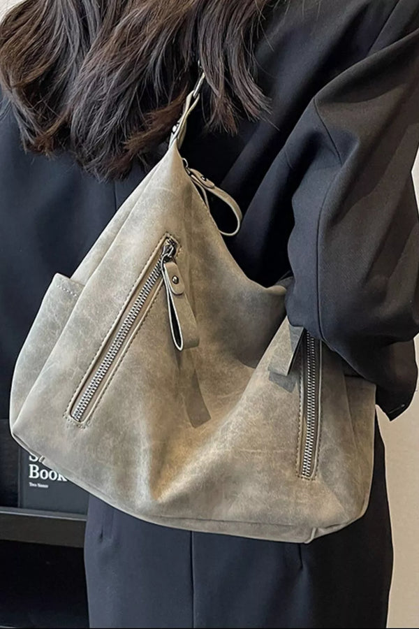 Medium PU leather crossbody bag with zipper details and adjustable strap