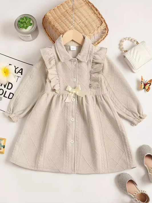 Children's ruffled bow collared neck dress in beige with long sleeves and button front