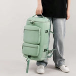 Large multi pocket travel backpack bag in light green oxford cloth with multiple zippered compartments