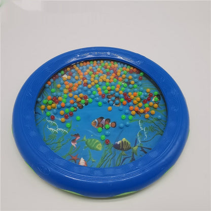 Colorful wave drum with sea life design, features blue frame and multicolored beads, ideal for children aged 4-6 as a portable percussion instrument.