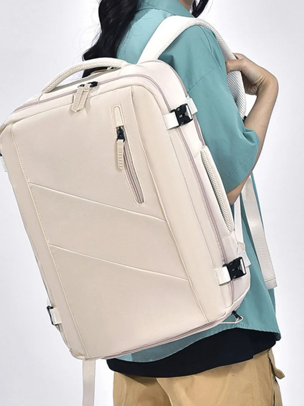 Large Oxford cloth backpack with adjustable straps in beige color worn by person